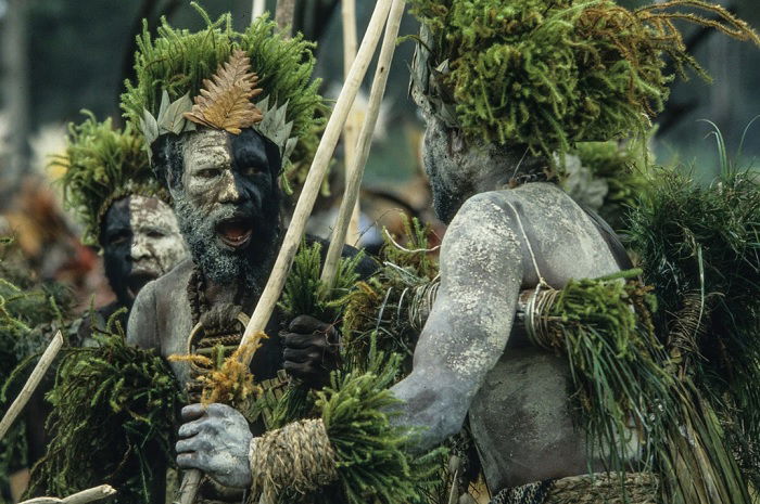 Tribesmen in ritual dress dancing